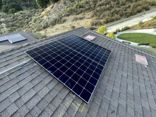 2 solar panels on back roof. Very clean install