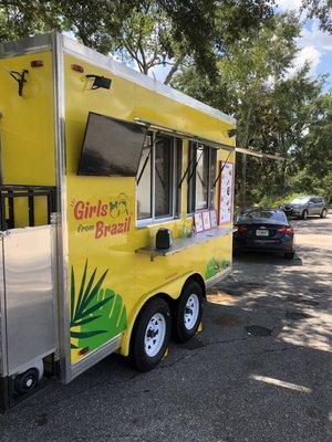 Their food trailer in the shade.