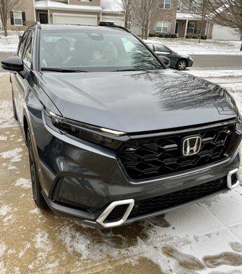 Waving at you from our new car!