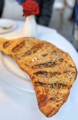 Katikli: Pide w/ spicy mix of spinach, aleppo pepper, cumin, za'atar, cheese in thin crust | $13