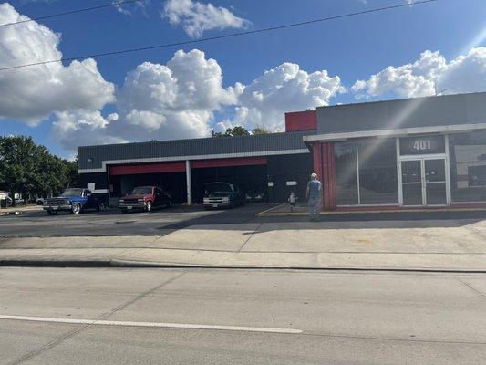 The shop and customers with there trucks  getting oil changes