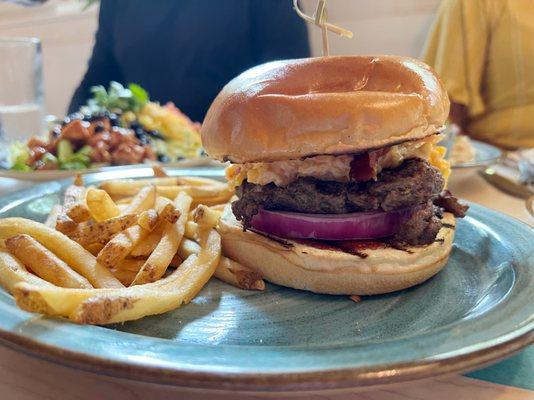 Southern Burger with smoked pork belly, bbq sauce, pimento cheese and red onion.