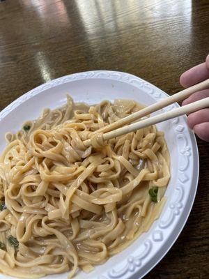 Yellow noodles in Peanut sauce