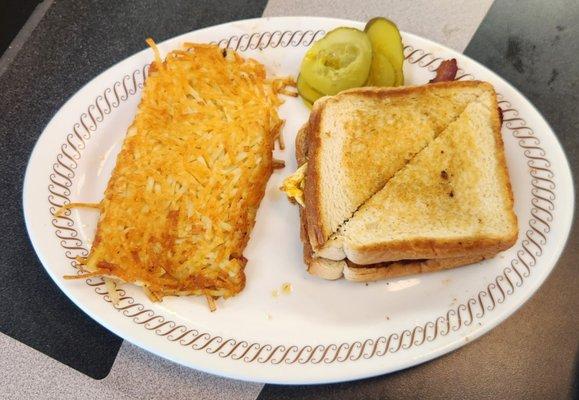 The Texas bacon, egg, and cheese sandwich with hash browns.