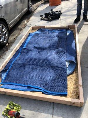 Marble top table needed a wooden crate for long term storage, table is fully covered.