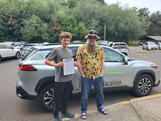 Benji with Happy student that passed Final drive