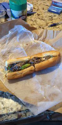 Philly cheese steak well cooked with onions and green peppers and provolone cheese. I would highly recommend them to all.