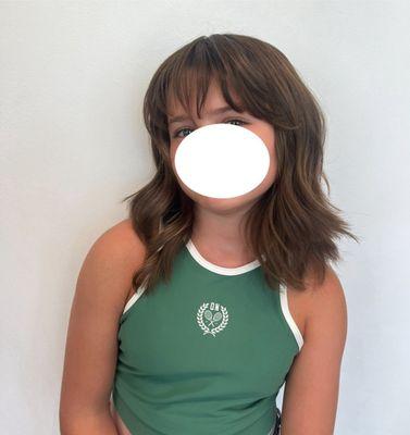 Child stylish hair cut with bangs