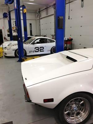 Some sweet cars in the garage.