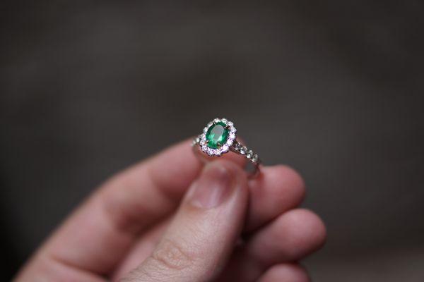 Emerald Ring surrounded by a Halo of Diamonds.