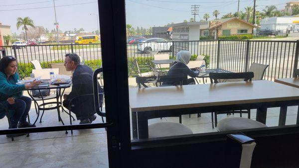 Small patio dining area plus 3 more tables inside