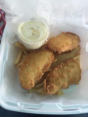 Fish strips basket with fried fish, fries and a breadstick