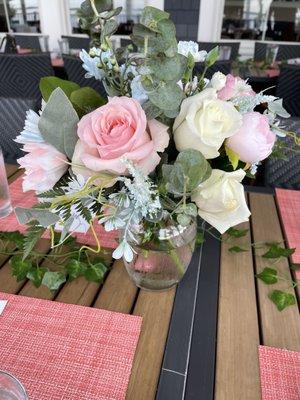 A light and vibrant table center piece made a college graduation