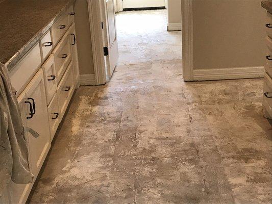 Demo of old tile in kitchen to prepare for new flooring