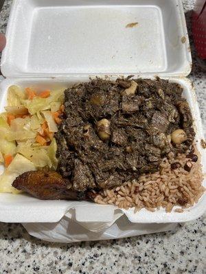 Cabbage, plantain, oxtails, rice and peas