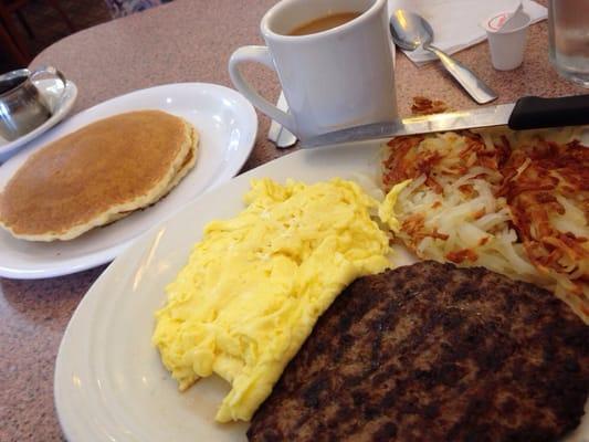 Chop steak, eggs, hash browns, 2 pancakes and coffee.