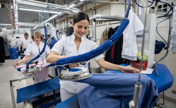 A young lady at work at Prestige Green Touch Cleaners is one of Los Angeles's premier dry cleaning companies