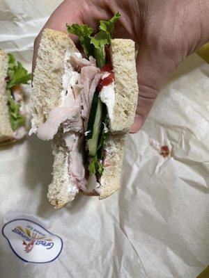 Delicious turkey, cranberry, cream cheese on sourdough.