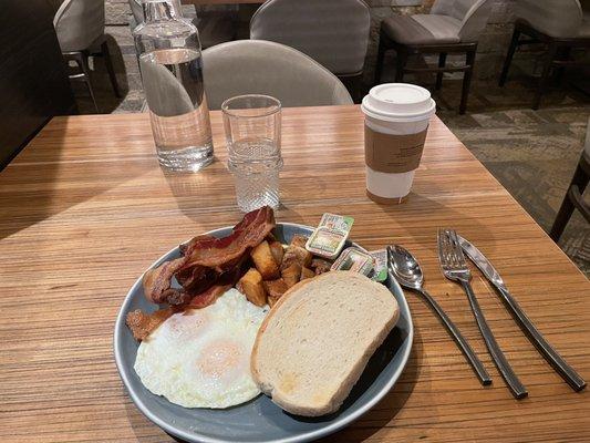 Eggs to order, sourdough toast, bacon and potatoes.