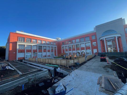 Front of school. Building courtyard and playground for pre-K/K school students