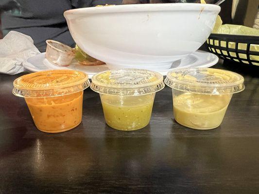 L-R Orange salsa was the hottest/best, green one was really good, guacamole-salsa was good but this batch had too much salt for me.