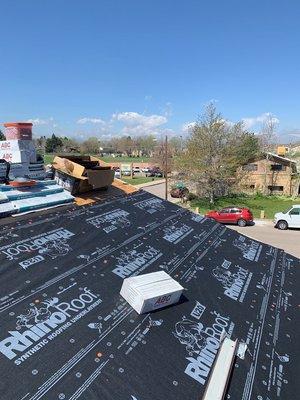 We use synthetic felt on all our aspahlt shingle installations.