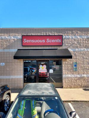 The Store front. Light box over awning reads sensuous scents.