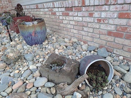 Mixed River blend rock with succulents in planters with irrigation