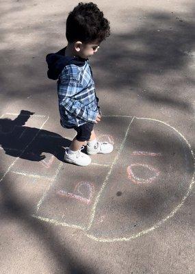 I bought chalk and made a hopscotch. The kids loved it.