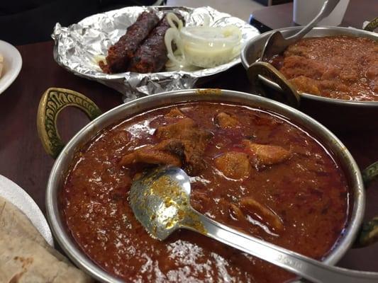 Closeup of chicken tikka (center) and goat karahi (right)