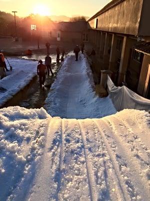 Top of a sled run on the Legacy campus at the beginning of SNOW DAY. Over 50 tons of snow is brought in for a day of fun!