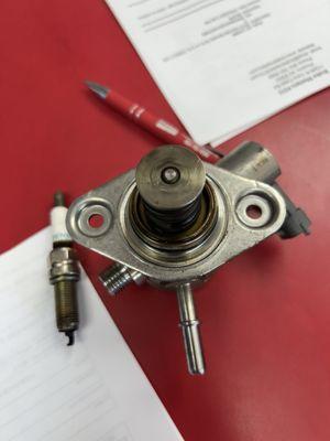 A spark plug that has seen better days and I believe this is the fuel pump