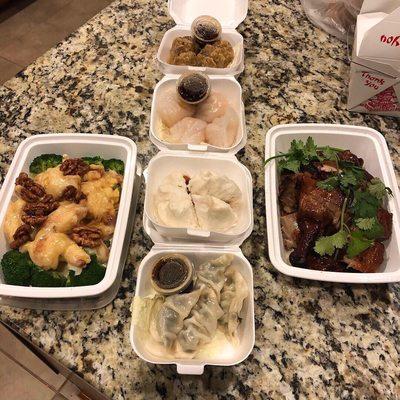 Honey walnut shrimp, shu Mai, har gow, steamed pork bun, pork and vegetable gyoza, half duck