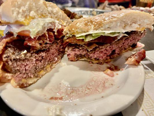 Bacon cheese burger cut open (and a bite )  sooo good