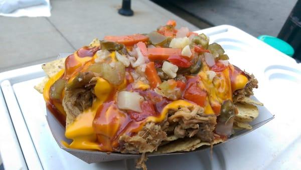 DTE (Down To Eat) Nachos with pulled pork, house made BBQ sauce, nacho cheese and mild giardiniera!