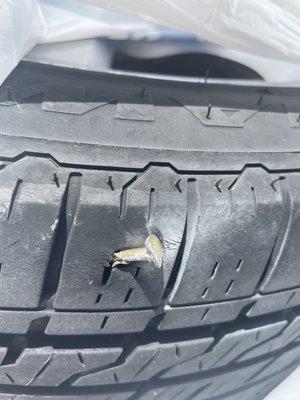 Tire with a nail in it