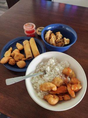 Sweet and sour chicken, white rice, fried dumplings, speing rolls