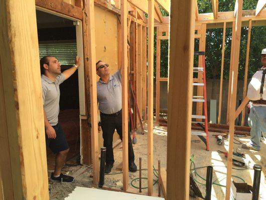 CEO Effram Perry and Daniel constructing a room addition