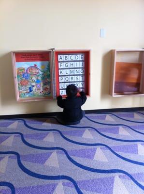 My son playing with the letters