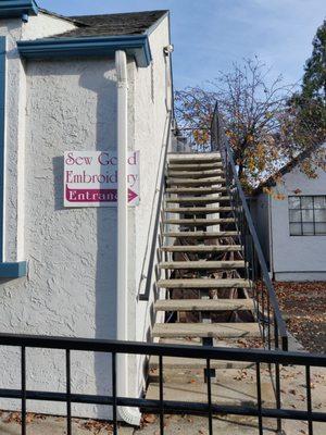 The entrance. Drive into the tiny school parking lot and go up the stairs in back.