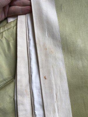 Dirt, stains, and grime still on linens after I took them home.