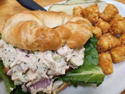 Homemade chicken salad on a large flaky croissant