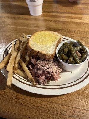 Pulled pork plate with fries and green beans.