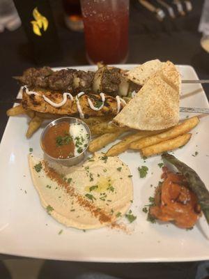 Duo skewer chicken and beef with fries and hummus