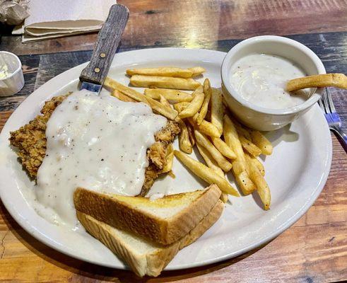 CHICKEN FRIED STEAK - Hand cut and battered. Served with Texas Toast & cream gravy with Fries!