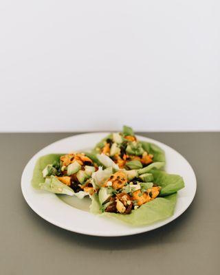 that's my yam tacos: sweet potato, black bean, bell pepper, corn, cilantro, tomato, lime dressing, avocado, butter lettuce