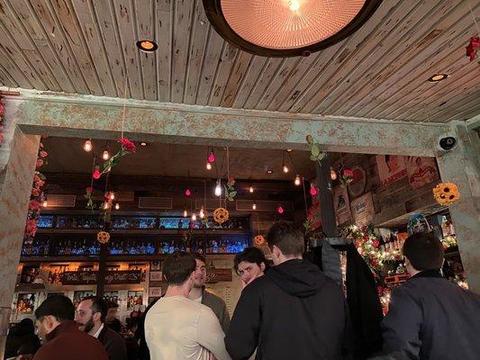 Interior. Bar and wall with flower decor on the right