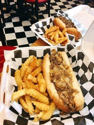 Cheesesteak and fries to-go - tastes good with hot pepper and some malt vinegar :)