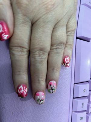 Holly is amazing. she evened them out and still was able to do her unique hand done nail art.