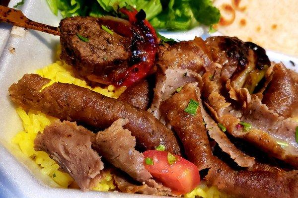 Gyro and steak souvlaki combo plate close up